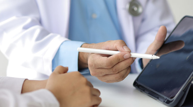 Doctor using tablet