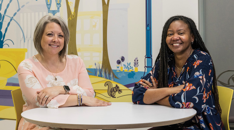 Quality Initiative Specialist Erin Pitchure (left) and Clinical Informatics Specialist Ericka Moore worked together to build a new analytics system at Akron Children's in Ohio.