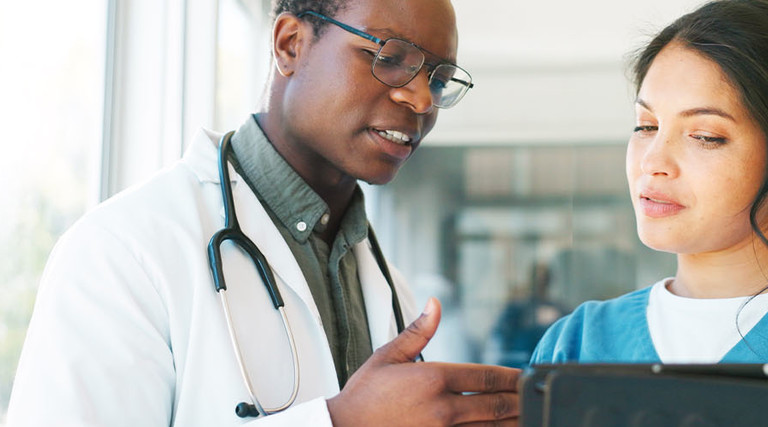 Doctors reviewing patient data