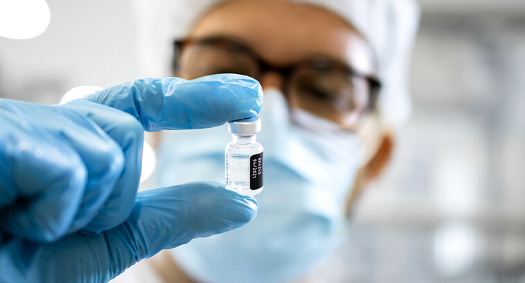 Pharmaceutical worker reviewing vaccine
